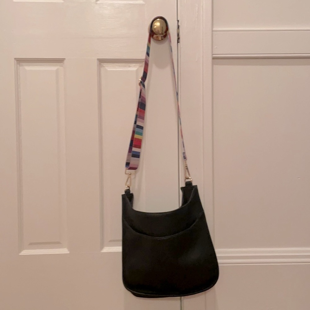 Adorable crossbody with interchangeable straps.